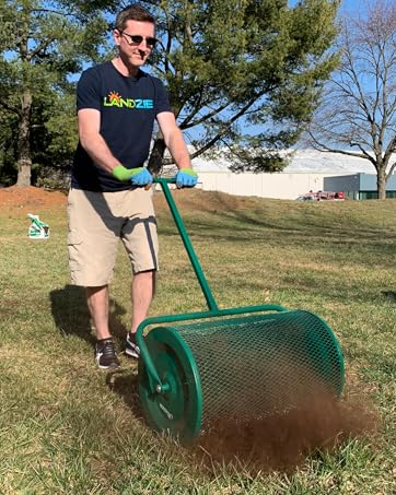 24 inch Landzie Push Lawn Spreader spreading compost on lawn